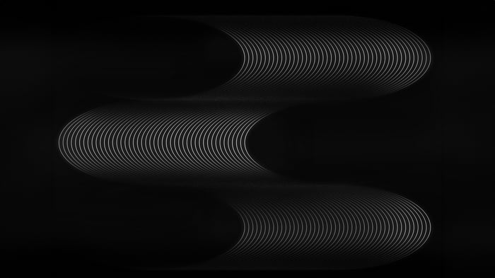 Black and white concentric circles forming waves