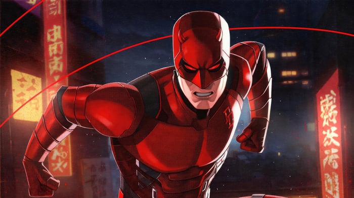 Daredevil in a red suit in a city at night