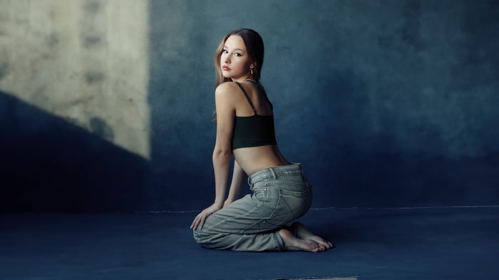 Girl Poses In Jeans Gazing Back