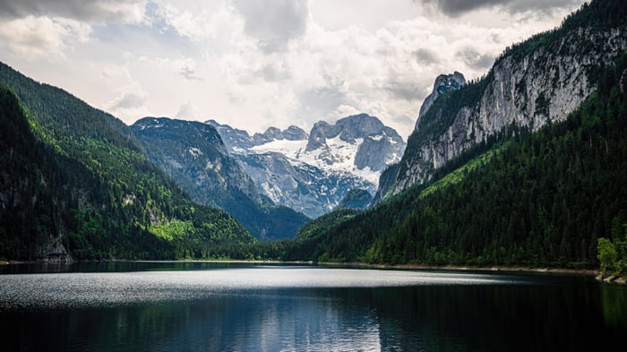 Mountains and Alps reflected in a lake at dusk