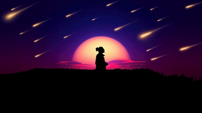 Silhouette of a person watching a meteor shower
