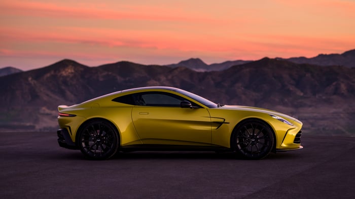 Yellow 2024 Aston Martin Vantage parked at sunset