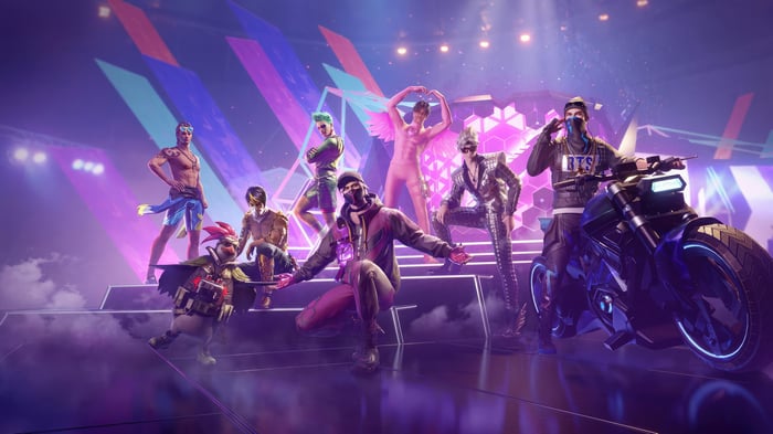 Garena Free Fire characters on a stage with a motorcycle