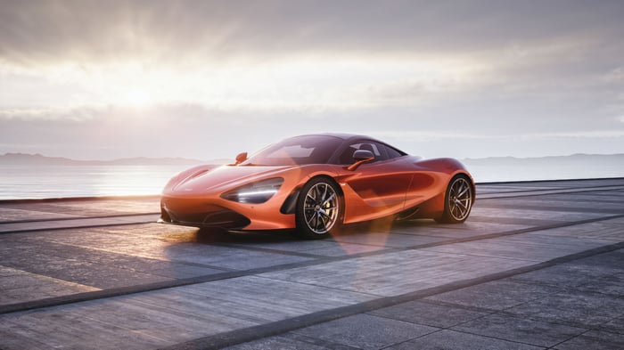 Orange McLaren 720s on a concrete surface