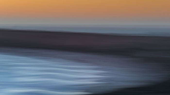 Abstract Ocean Sunset with Blurred Waves