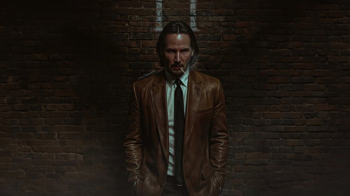 John Wick in a brown leather jacket