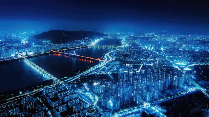 Aerial view of a city at night with blue lights