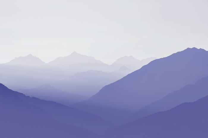 Purple Hues of Distant Mountains in Fog