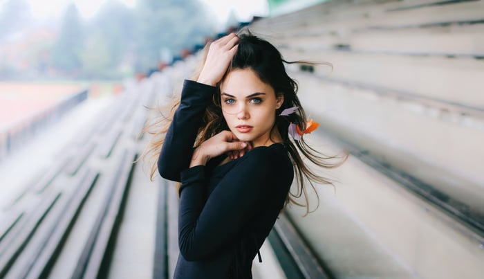 Girl with blue eyes at a stadium