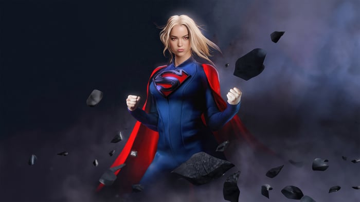 Supergirl in a blue and red costume with a cape
