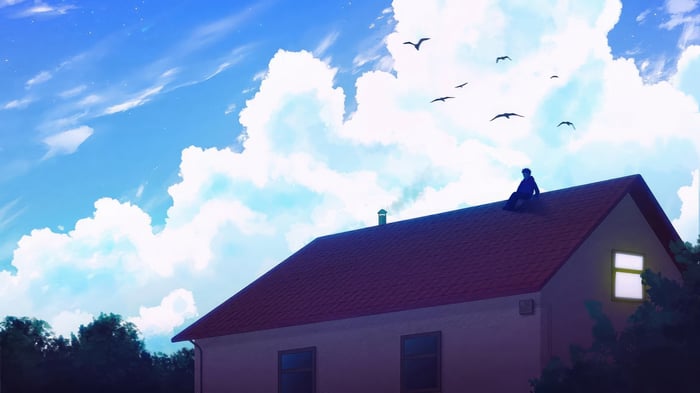 Person sitting on a rooftop under a cloudy sky