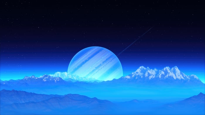 Ringed Planet Over Snowy Mountains and Fog