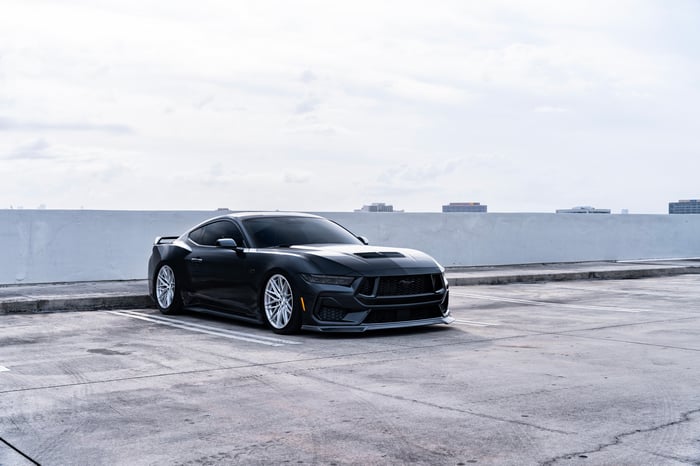 Black Ford Mustang parked in a lot