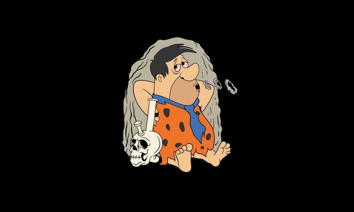 Fred Flintstone smoking from a bong