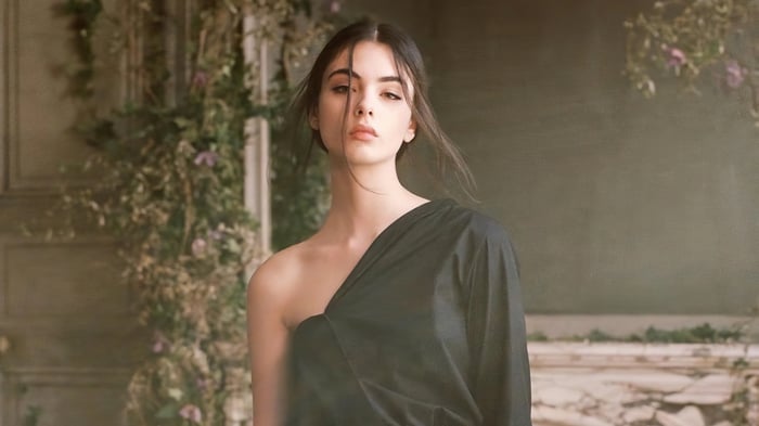 Deva Cassel in a black dress