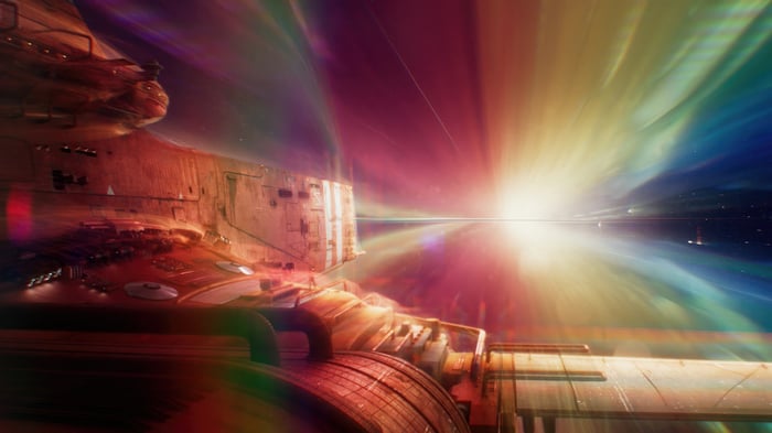 Concord spaceship traveling through a rainbow nebula