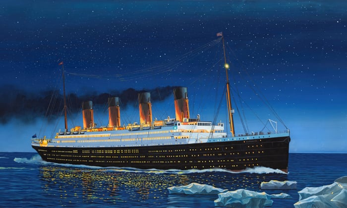 The Titanic sailing at night with icebergs