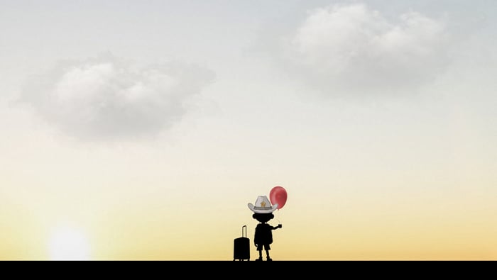 Silhouette of a boy with a balloon and suitcase