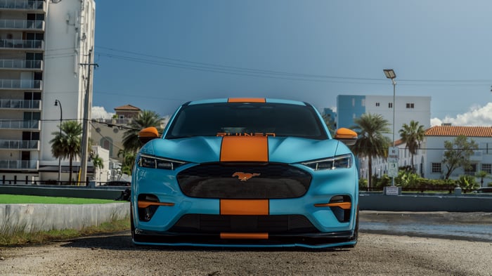 Blue and orange Ford Mustang Mach-E with racing stripes