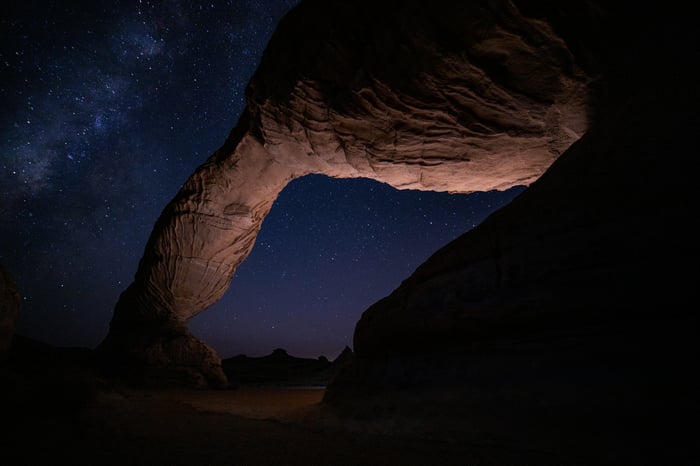 Rock formation under a starry night sky