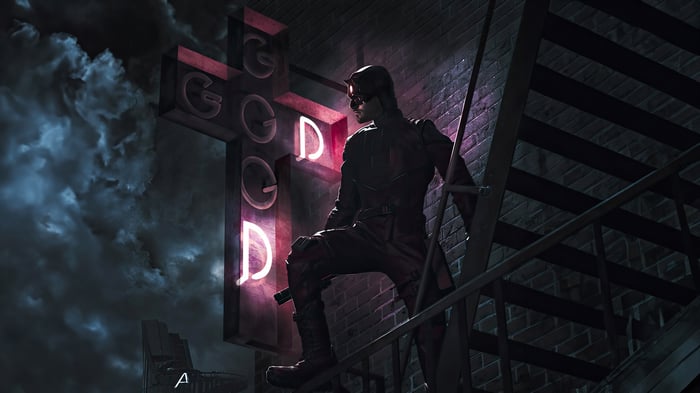 Daredevil on a fire escape at night