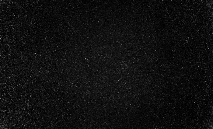 Black textile with glitter on a black background