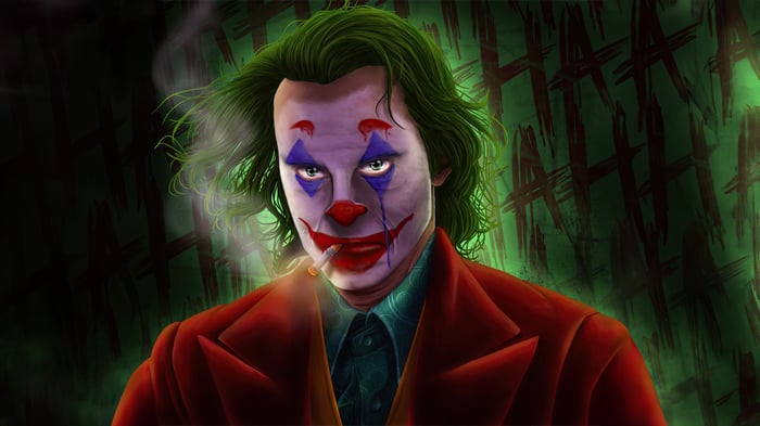Joker smoking with 'HA HA' graffiti in the background