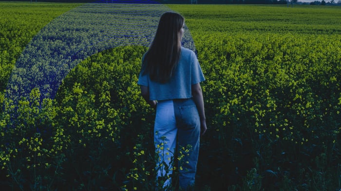 Girl in a field of yellow flowers