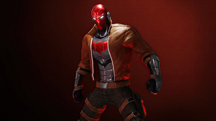 Red Hood stands against a red background