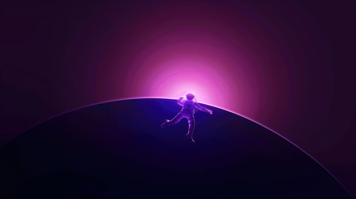 Astronaut falling in space with a bright pink sun