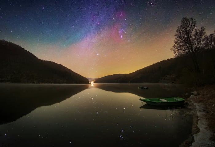 Boat on a lake under the Milky Way