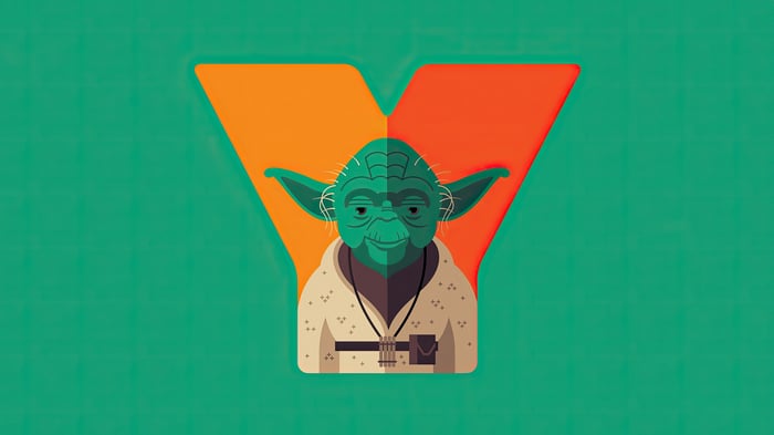 Yoda, Jedi Master, in front of a stylized Y