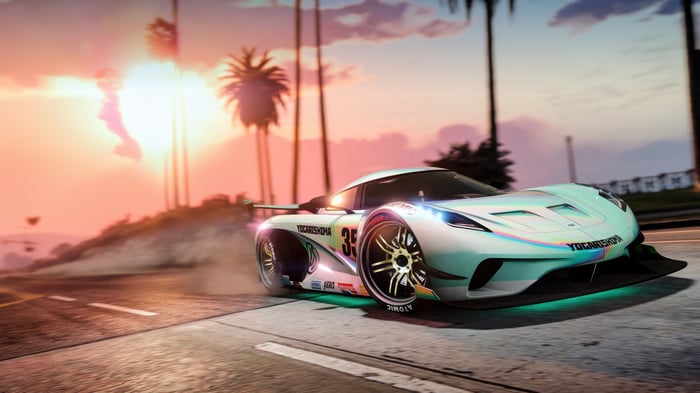 White racing car drifting at sunset