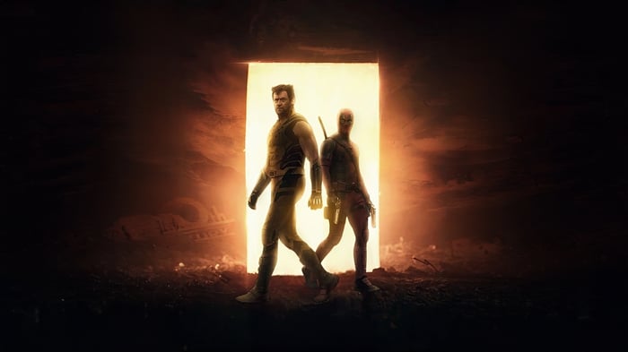 Deadpool and Wolverine walk through a glowing portal