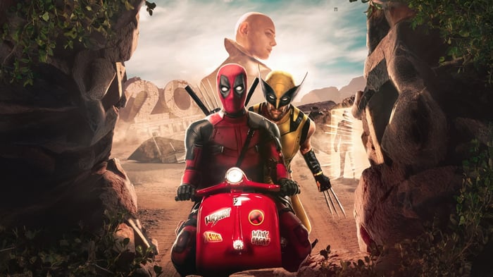 Deadpool and Wolverine on a scooter in a desert