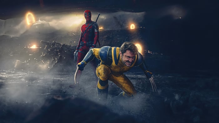 Deadpool and Wolverine in a dark, smoky landscape