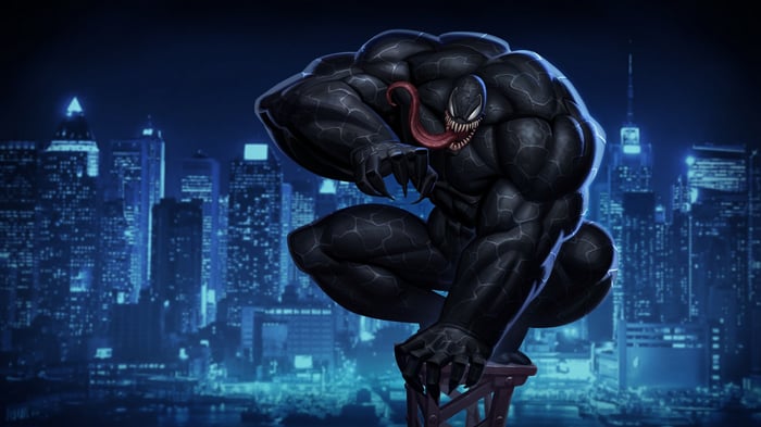 Venom crouches on a platform overlooking a city at night