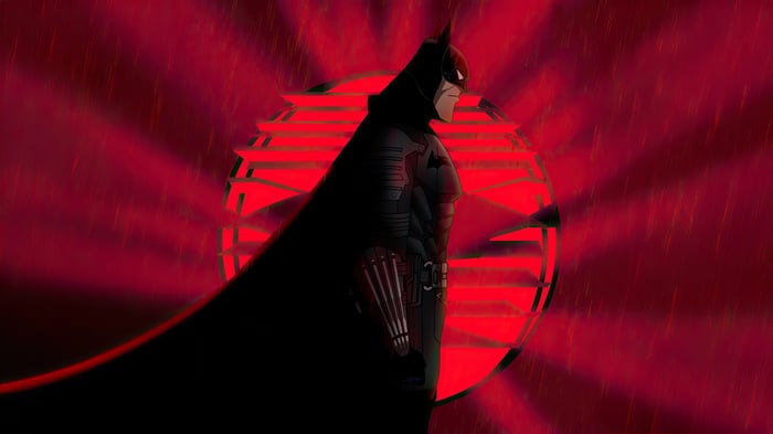 Batman in front of a red sunburst