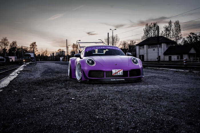 Purple Widebody Porsche 992 at Train Station
