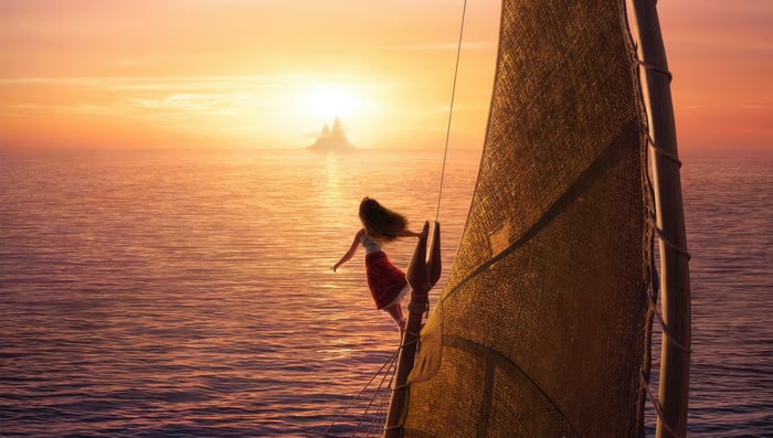 Moana on a sailboat at sunset