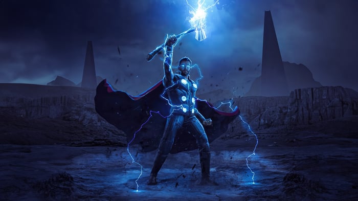 Thor with Mjolnir and lightning in a desolate landscape