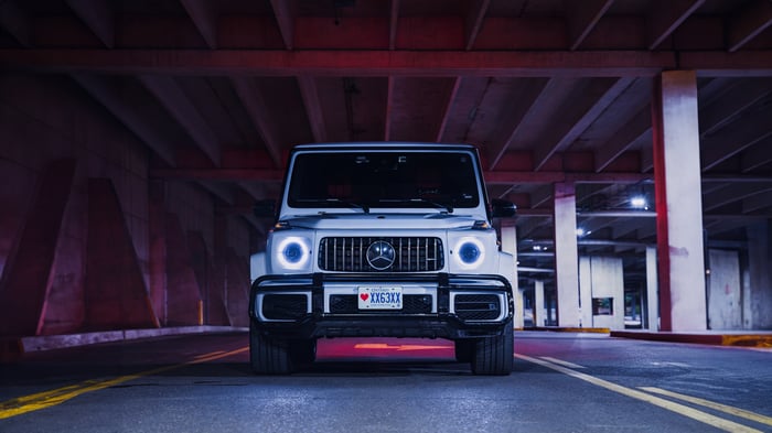 White Mercedes G Wagon parked under a bridge