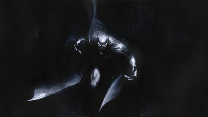 Batman in a dark, smoky environment