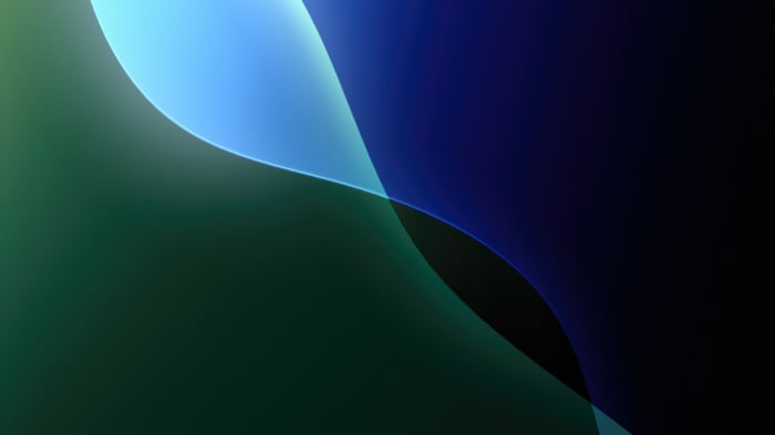 Abstract green and blue curves on dark background
