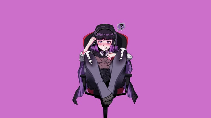 Hilda sitting in a gaming chair with headphones
