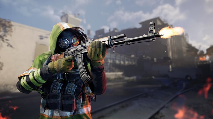 Tom Clancy's XDefiant character firing assault rifle