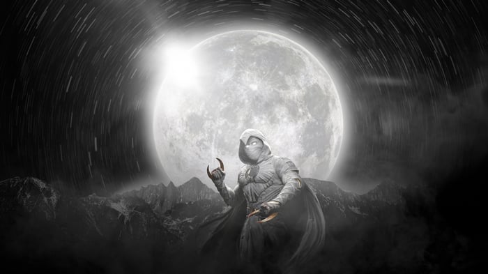 Moon Knight in front of a large moon