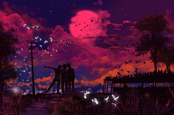 Friends watching birds fly under a pink moon