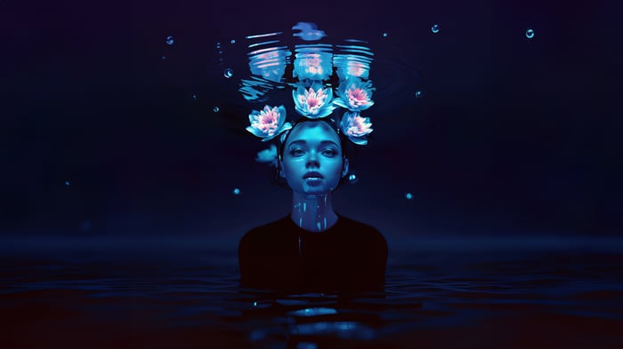 Woman with flowers submerged in water