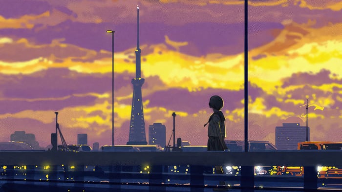 Girl walking alone on a bridge at sunset